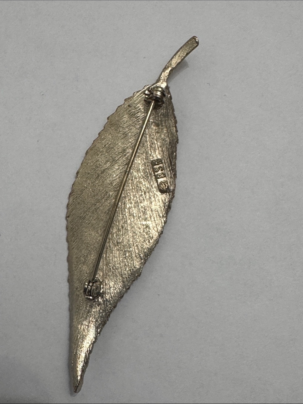 vintage silver-tone textured leaf brooch signed by BSK